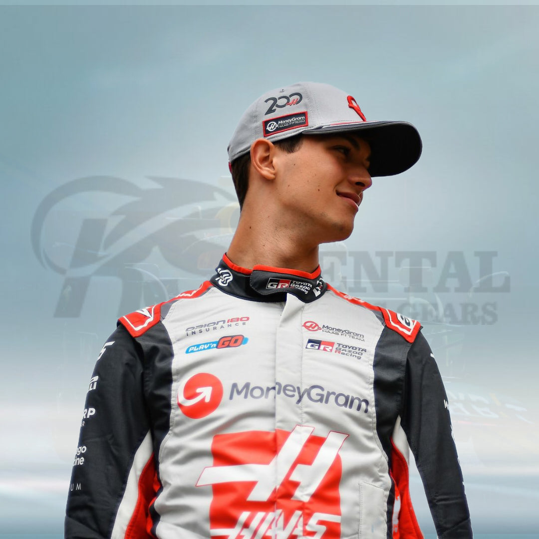Person wearing a racing suit with visible branding against a blurred background